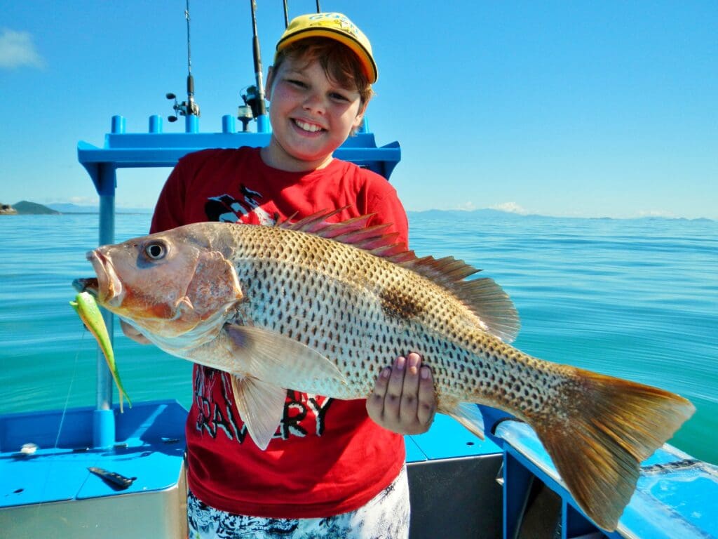 Jordan Moody with golden snapper caught on soft plastic
